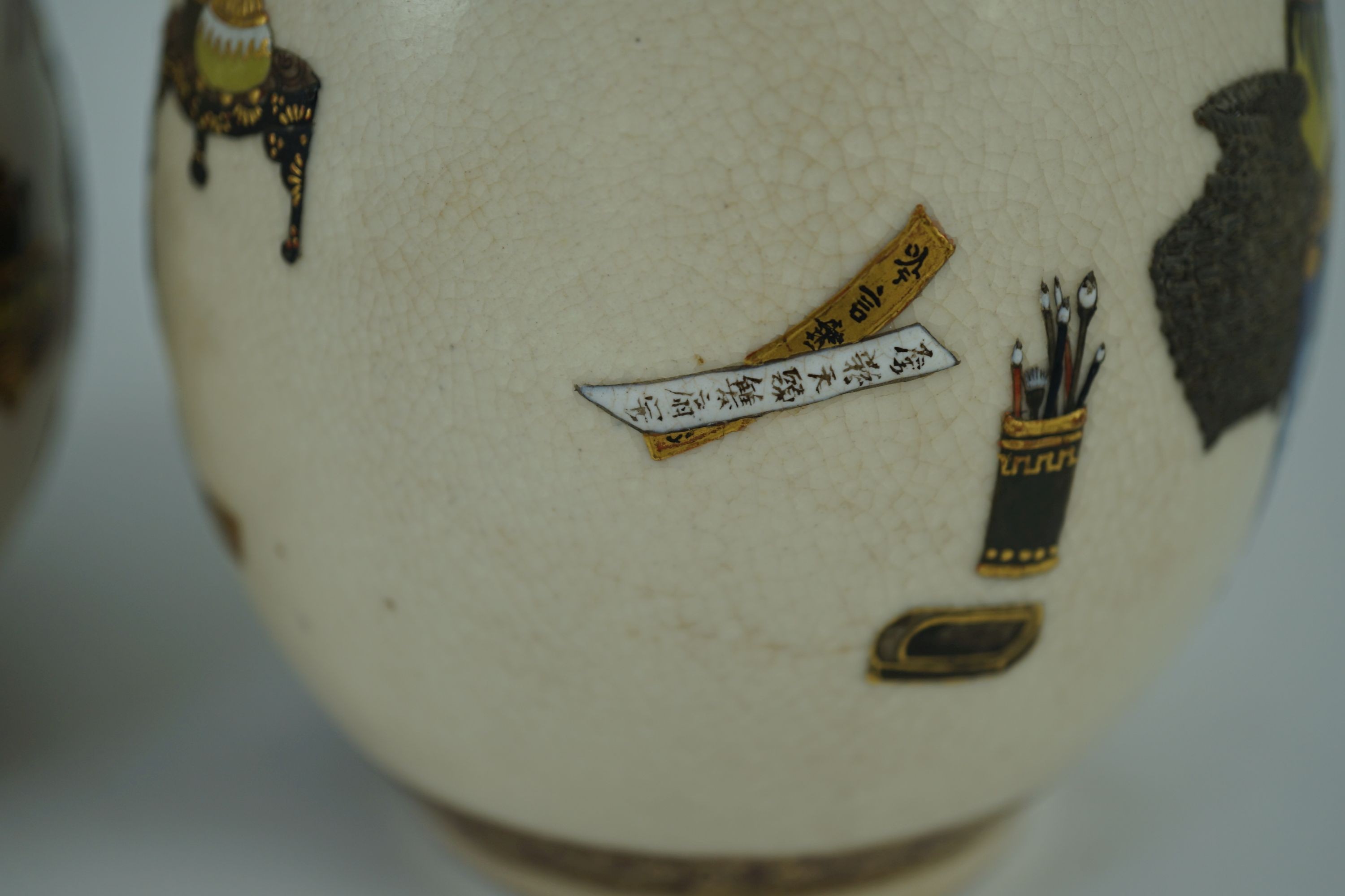 A pair of Japanese Satsuma pottery vases, by Bizan, Meiji period, 18.2cm high